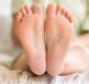 what causes skin on your feet and heels to crack and split