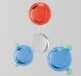 Scientific equipment displaying three colourful plates in red, blue and white demonstrating urea in skincare