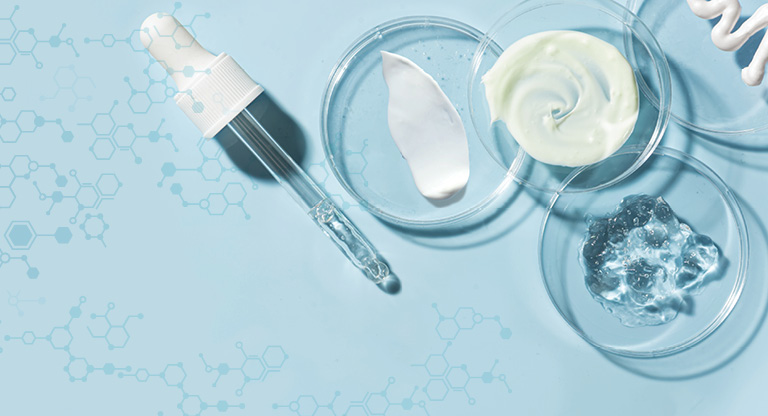 Promotional graphic on a light blue background with molecule chains and laboratory dishes with swashes of gel, cream and lotion