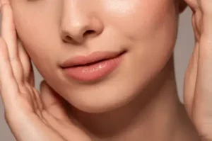 Close up of woman's lips wearing Manuka Lip Balm